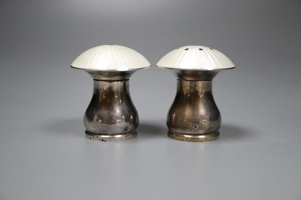 A pair of mid 20th century Danish sterling and enamel mushroom shaped condiments, by Egon Lauridsen, height 42mm.